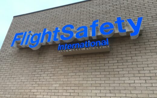 Flight Safety International in neon blue letters.