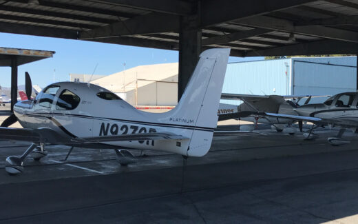 the airplanes parked, locked, and under cover.